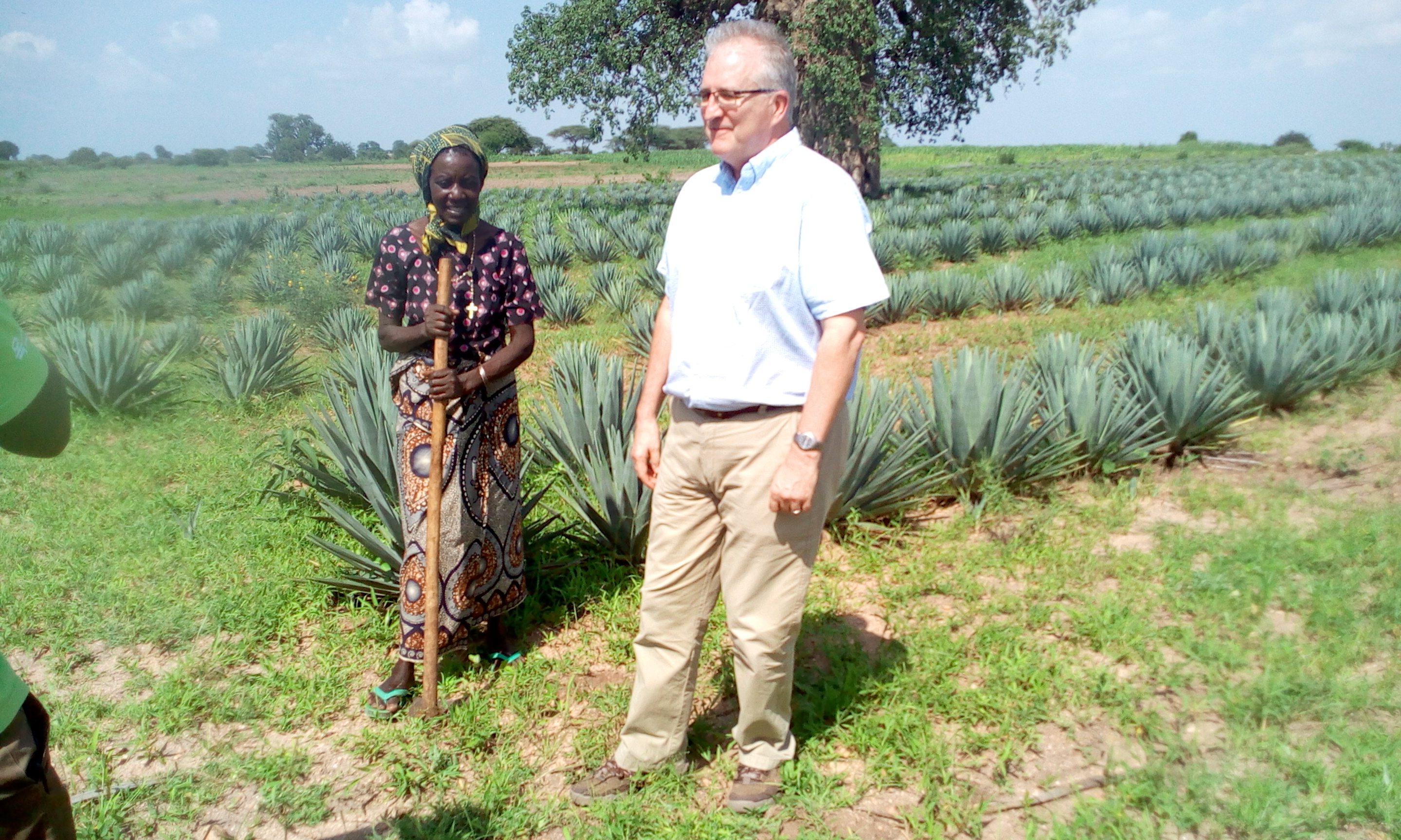 One of Sisal farmer members with OXFAM guest at her farm at Isoso Majengo village in Kishapu
