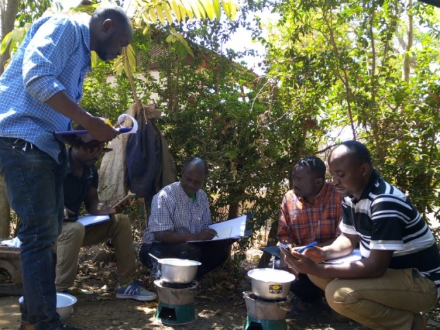 Farmers group testing the efficiency of Briquette in Kankoko District