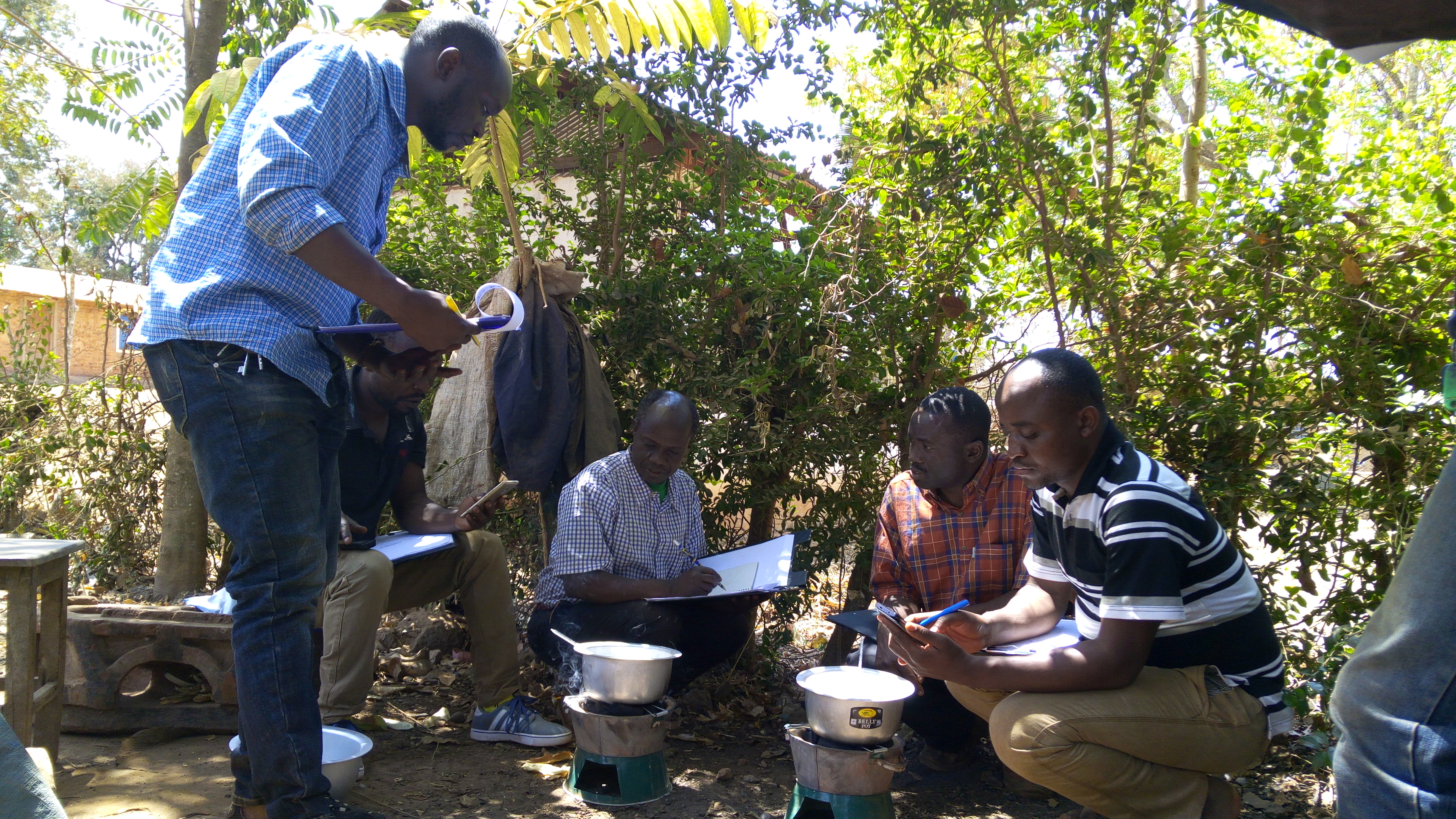 Farmers group testing the efficiency of Briquette in Kankoko District